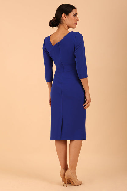 model wearing a diva catwalk Kubrick Asymmetric Neckline Pencil Dress 3/4 sleeve in cobalt blue