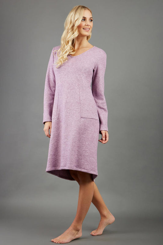 blonde model wearing diva catwalk irena cosy sleeved knee length dress with pockets and v-neckline in soft fabric pink front