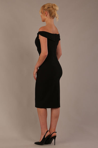 Model wearing the Diva Cloud Luxury Ripple Crepe cloud off-shoulder dress  design in black front image against a plain background