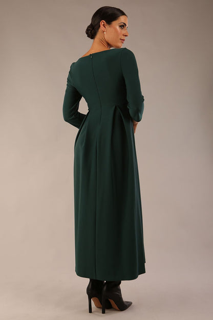 Brunette Model is wearing 3/4 sleeve sweetheart neckline swing forest green dress (Forest Green)