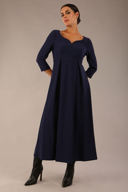 Brunette Model is wearing 3/4 sleeve sweetheart neckline swing navy blue dress (Navy Blue)