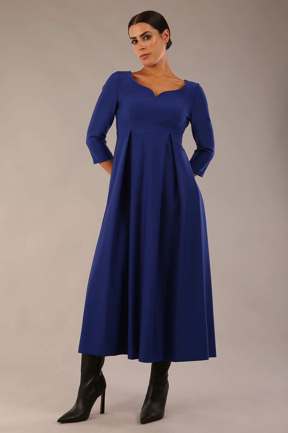 Brunette Model is wearing 3/4 sleeve sweetheart neckline swing cobalt blue dress (Cobalt Blue)