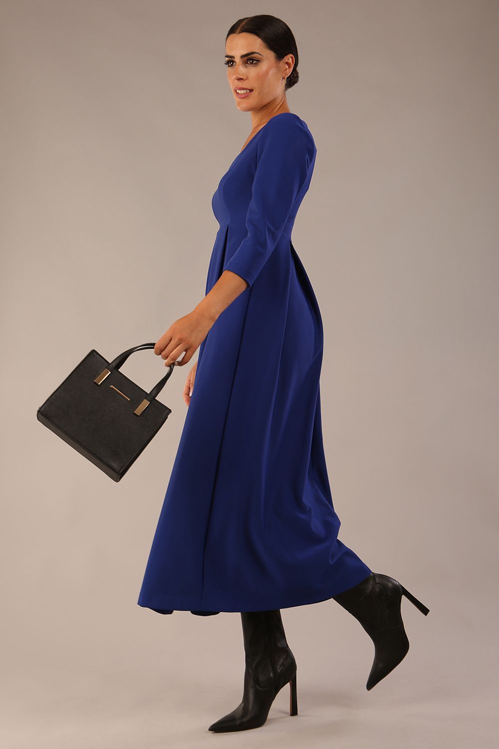 Brunette Model is wearing 3/4 sleeve sweetheart neckline swing cobalt blue dress (Cobalt Blue)