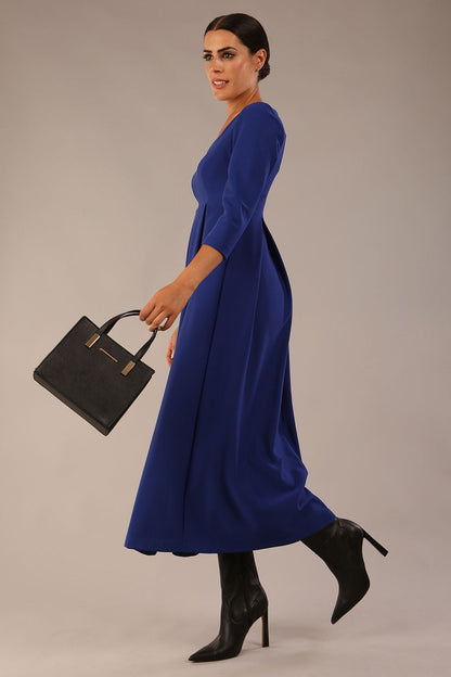 Brunette Model is wearing 3/4 sleeve sweetheart neckline swing cobalt blue dress (Cobalt Blue)