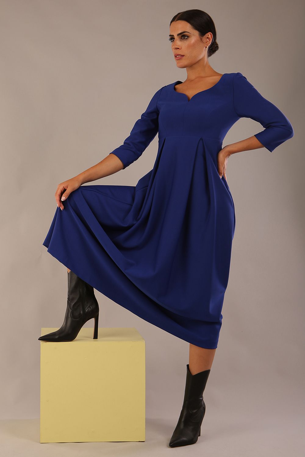 Brunette Model is wearing 3/4 sleeve sweetheart neckline swing cobalt blue dress (Cobalt Blue)