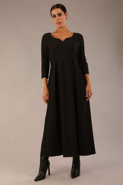Brunette Model is wearing 3/4 sleeve sweetheart neckline swing black dress (Black)