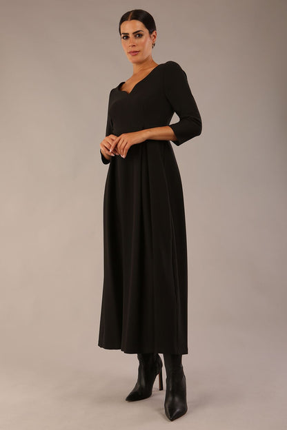 Brunette Model is wearing 3/4 sleeve sweetheart neckline swing black dress (Black)
