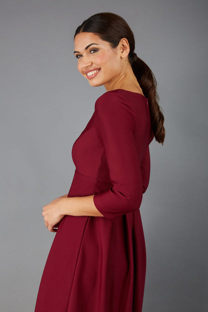 Brunette Model is wearing 3/4 sleeve sweetheart neckline  swing burgundy dress (Blissful Burgundy)