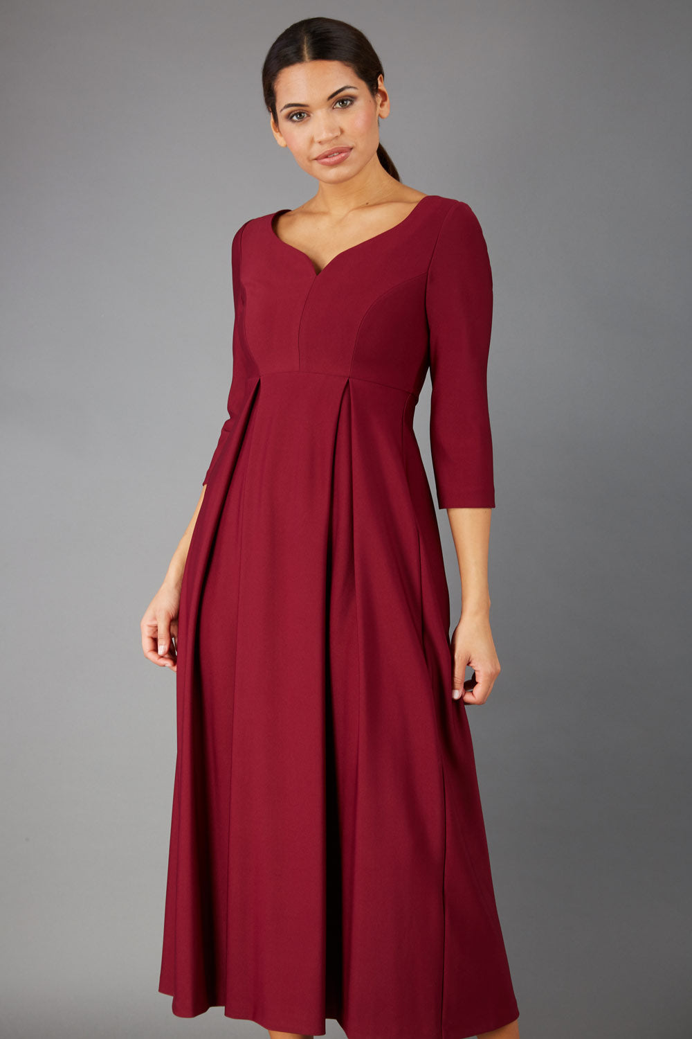 Brunette Model is wearing 3/4 sleeve sweetheart neckline  swing burgundy dress (Blissful Burgundy)