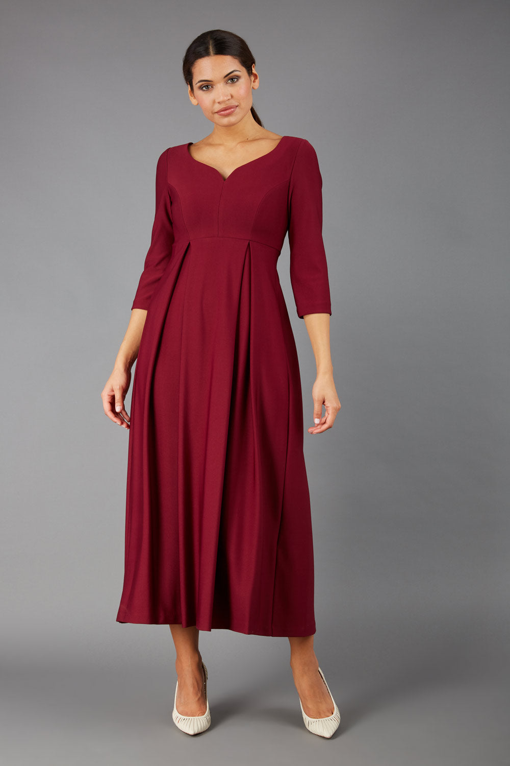 Brunette Model is wearing 3/4 sleeve sweetheart neckline  swing burgundy dress (Blissful Burgundy)