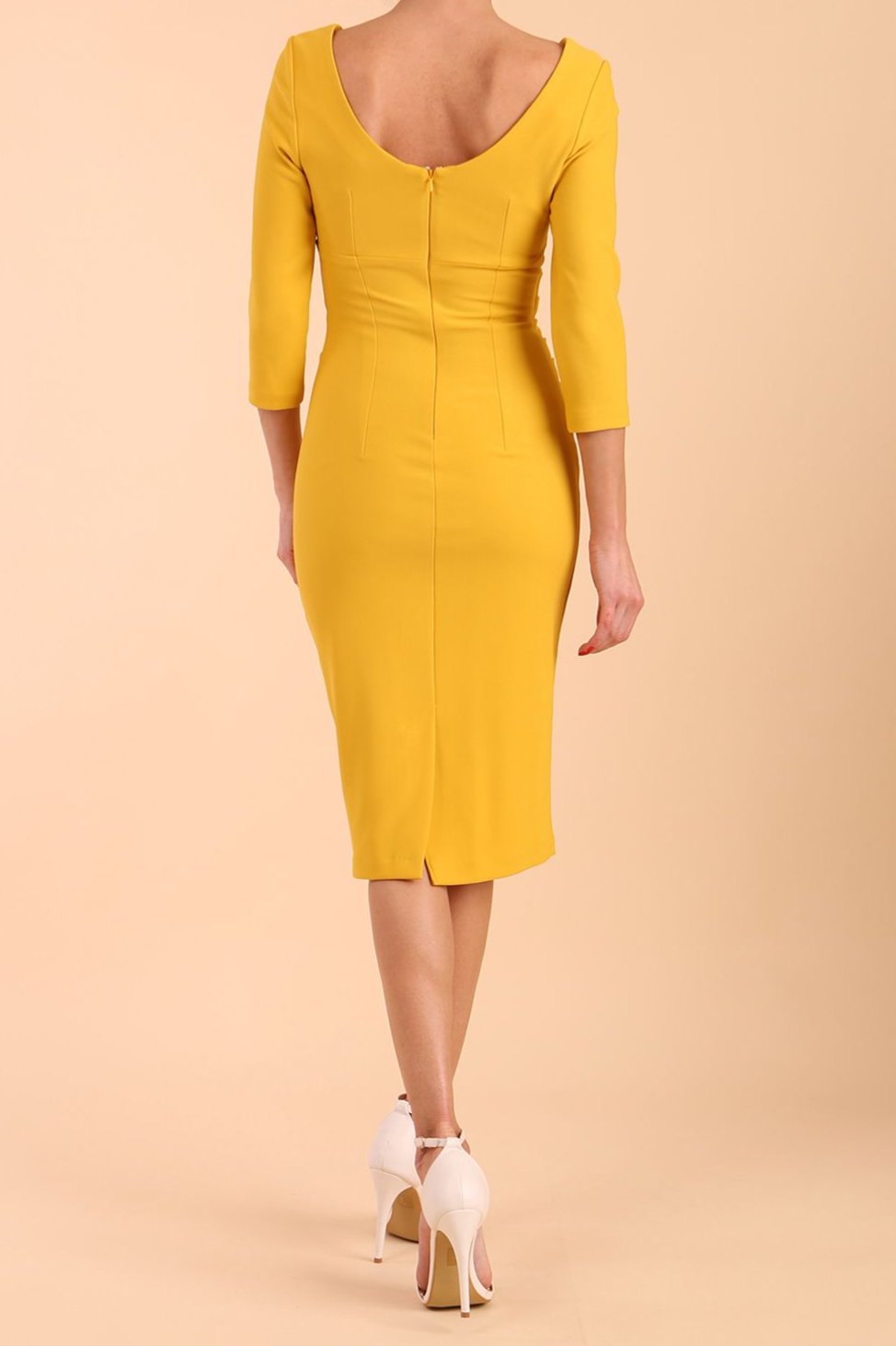 model is wearing diva catwalk polly sleeved pencil dress with low rounded neckline at the back in Mustard Yellow 