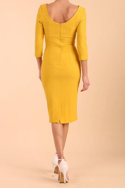 model is wearing diva catwalk polly sleeved pencil dress with low rounded neckline at the back in Mustard Yellow 