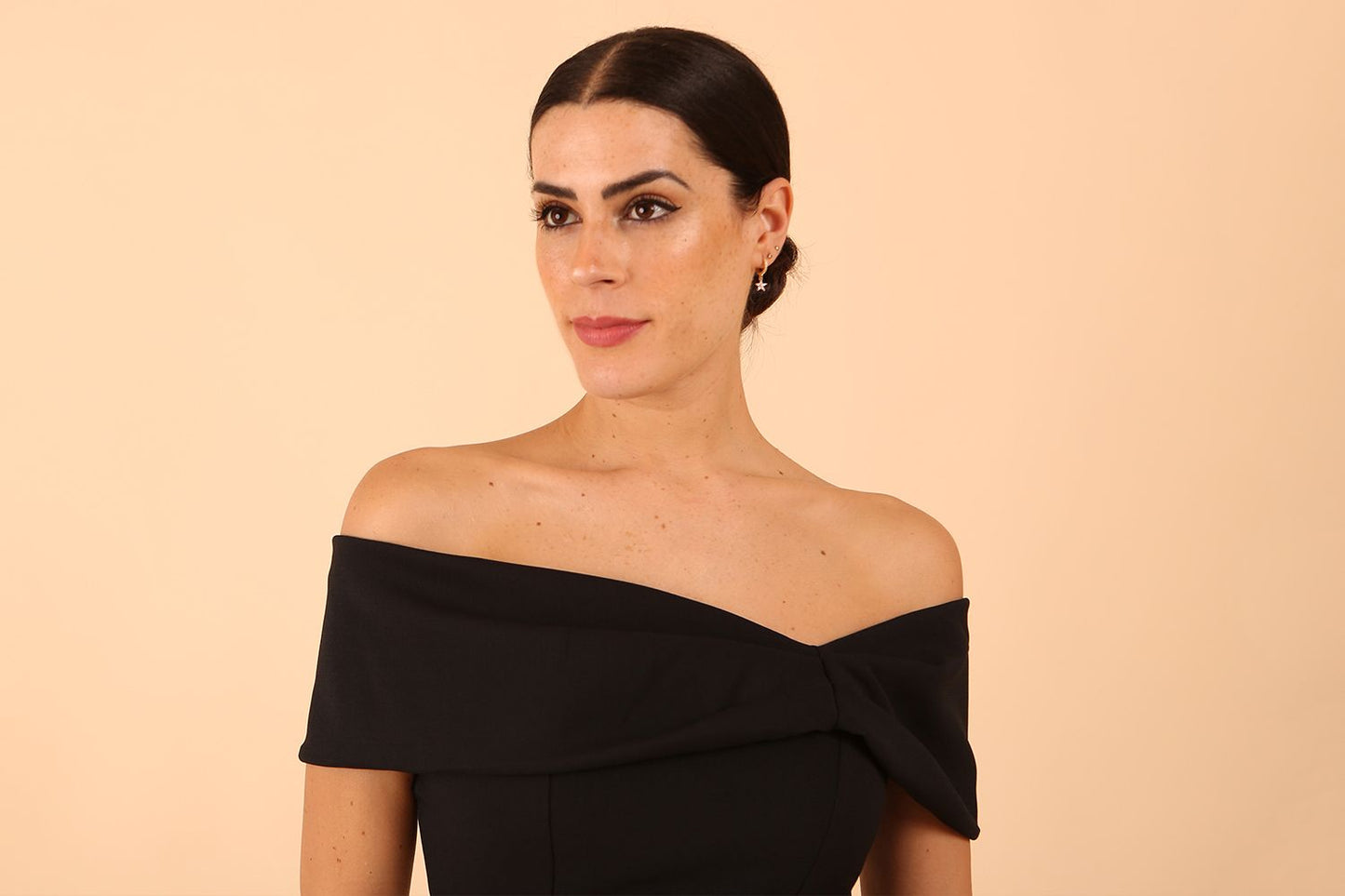 model is wearing diva catwalk mariposa pencil dress with Detailed Bardot neckline with fold-over detail and pleated at waist area in Black front close up