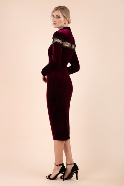 blonde model wearing diva catwalk burgundy pencil dress called trocadero pencil midaxi style with funnel neckline and lace detail and long sleeves front
