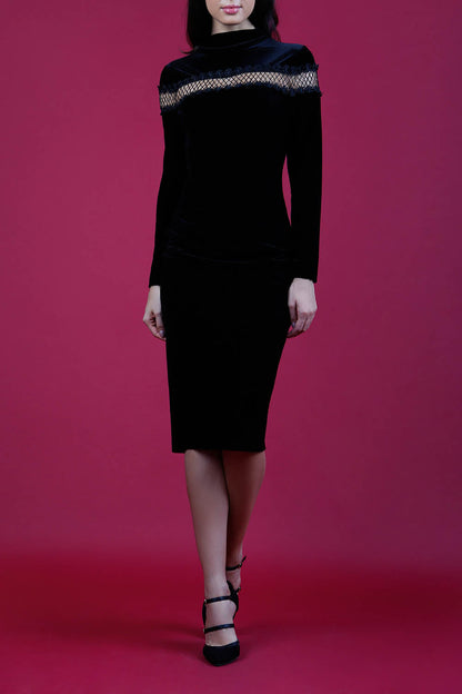 blonde model wearing diva catwalk black pencil dress called trocadero pencil midaxi style with funnel neckline and lace detail and long sleeves front