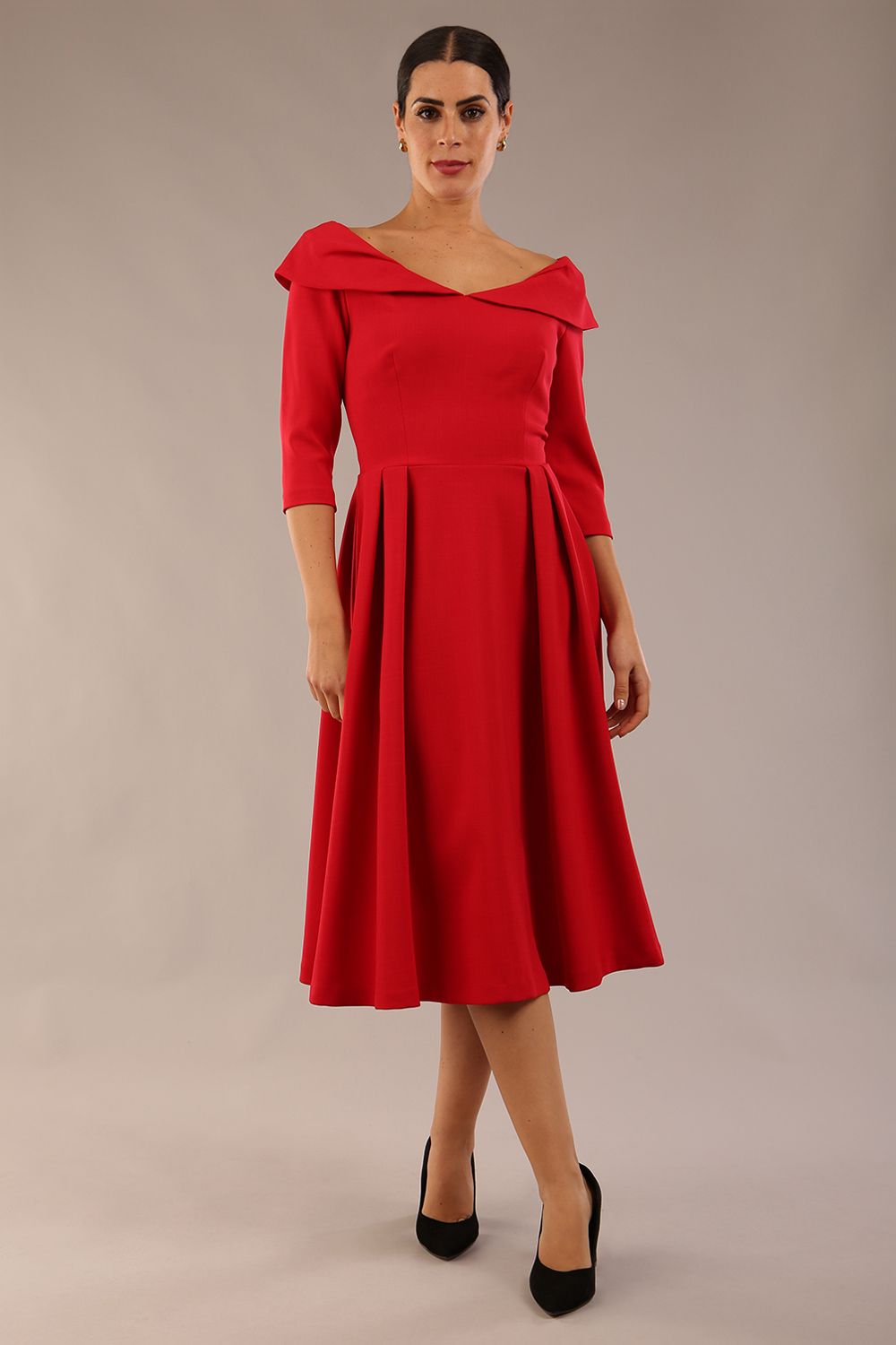 Model wearing Diva Catwalk Chesterton Sleeved dress with oversized collar detail and a-line swing pleated skirt in colour red front
