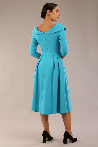 Model wearing Diva Catwalk Chesterton Sleeved dress with oversized collar detail and a-line swing pleated skirt in colour azure blue front side