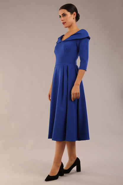 Model wearing Diva Catwalk Chesterton Sleeved dress with oversized collar detail and a-line swing pleated skirt in colour cobalt blue front