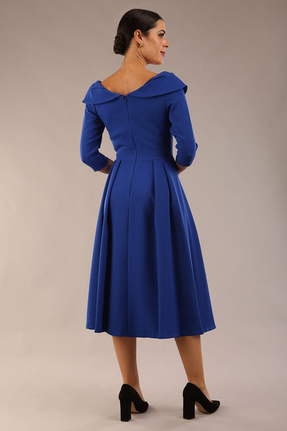 Model wearing Diva Catwalk Chesterton Sleeved dress with oversized collar detail and a-line swing pleated skirt in colour cobalt blue front