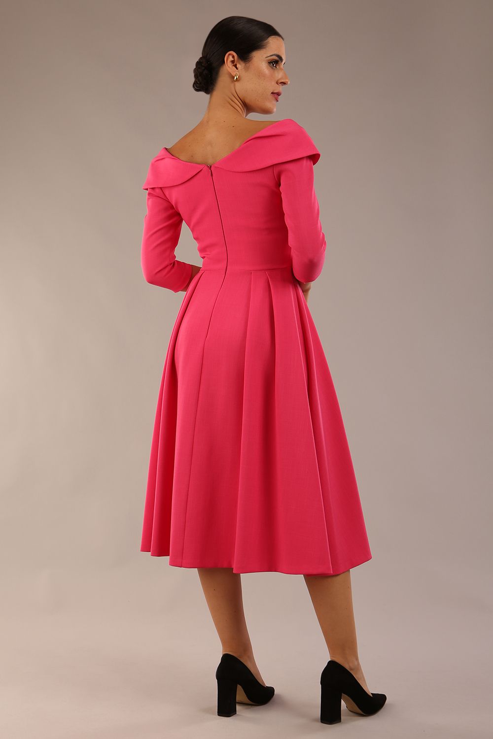 Model wearing Diva Catwalk Chesterton Sleeved dress with oversized collar detail and a-line swing pleated skirt in colour fuchsia pink front