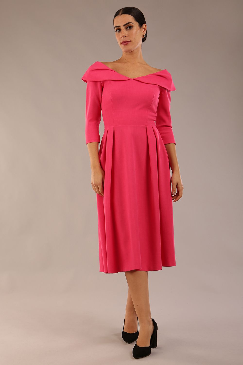 Model wearing Diva Catwalk Chesterton Sleeved dress with oversized collar detail and a-line swing pleated skirt in colour fuchsia pink front