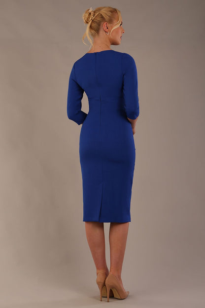 model is wearing the Diva Catwalk Ubrique pencil dress with Long sleeves and keyhole detail in Cobalt Blue fabric colour (Cobalt Blue)
