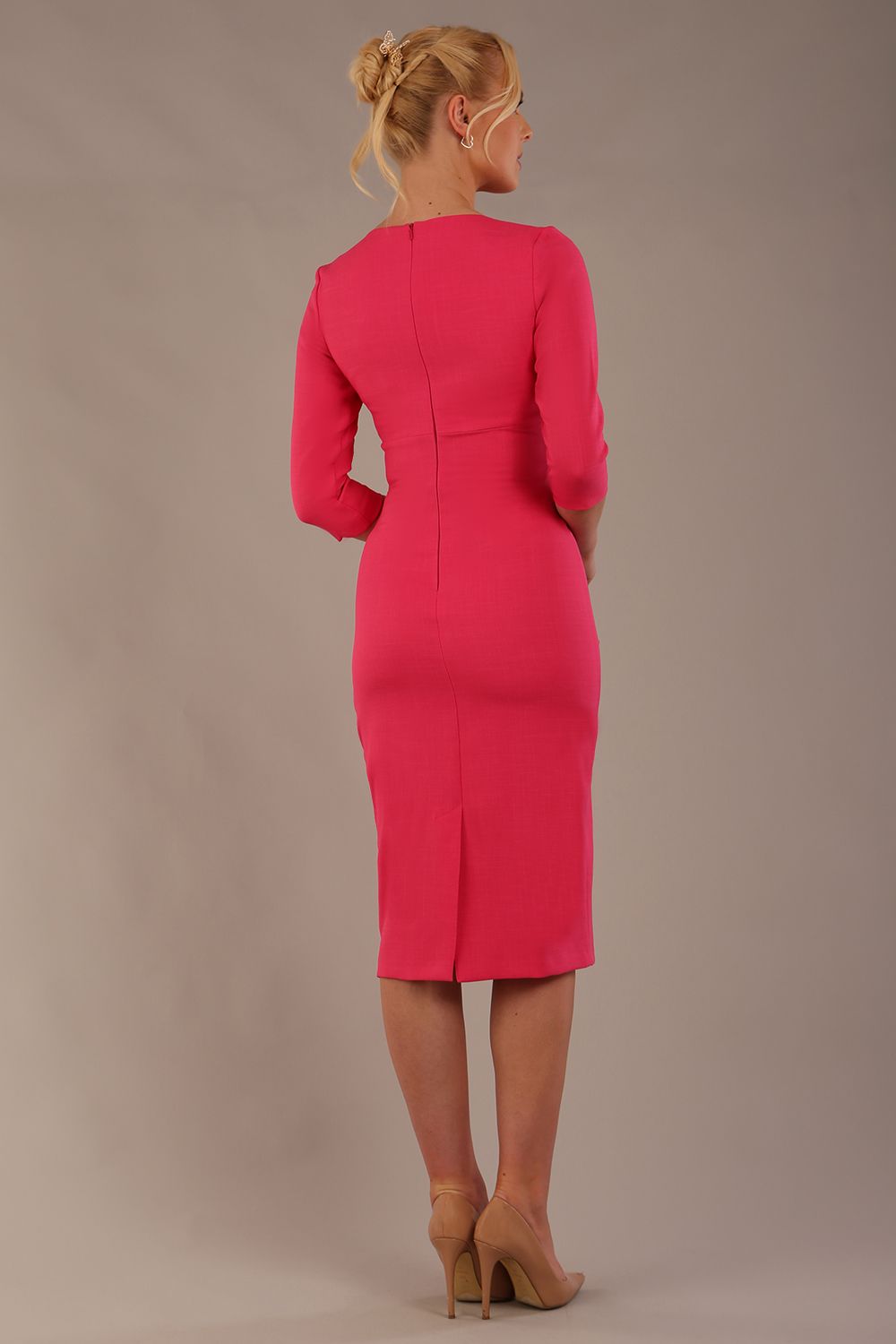 brunette model wearing diva catwalk ubrique pencil dress with a keyhole detail and sleeves in fuchsia pink front (Fuchsia Pink)