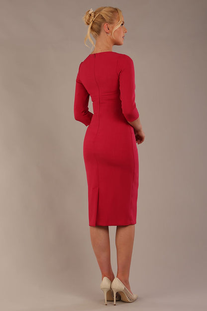 model is wearing the Diva Catwalk Ubrique pencil dress with Long sleeves and keyhole detail in Raspberry Pink fabric colour (Raspberry Pink)