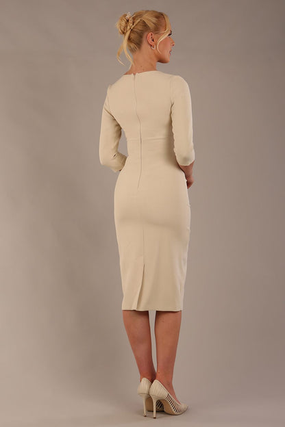 blonde model wearing diva catwalk ubrique pencil dress with a keyhole detail and sleeves in sandshell beige  front  (Sandshell Beige)