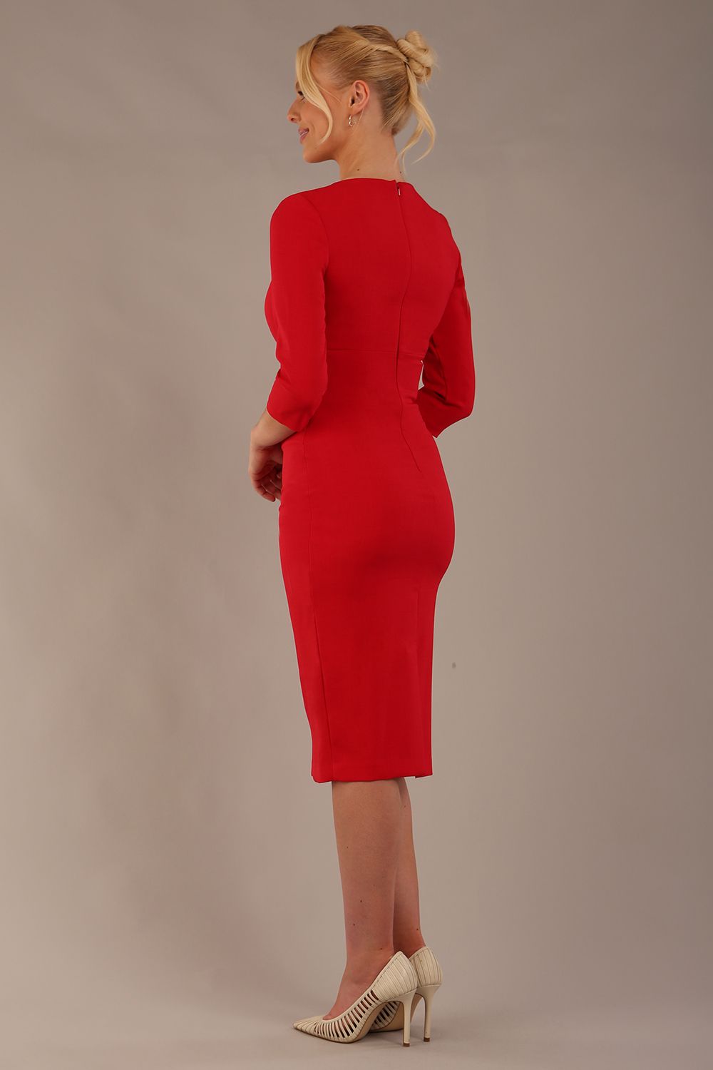 model wearing diva catwalk ubrique pencil dress with a keyhole detail and sleeves in scarlet red (Scarlet Red)