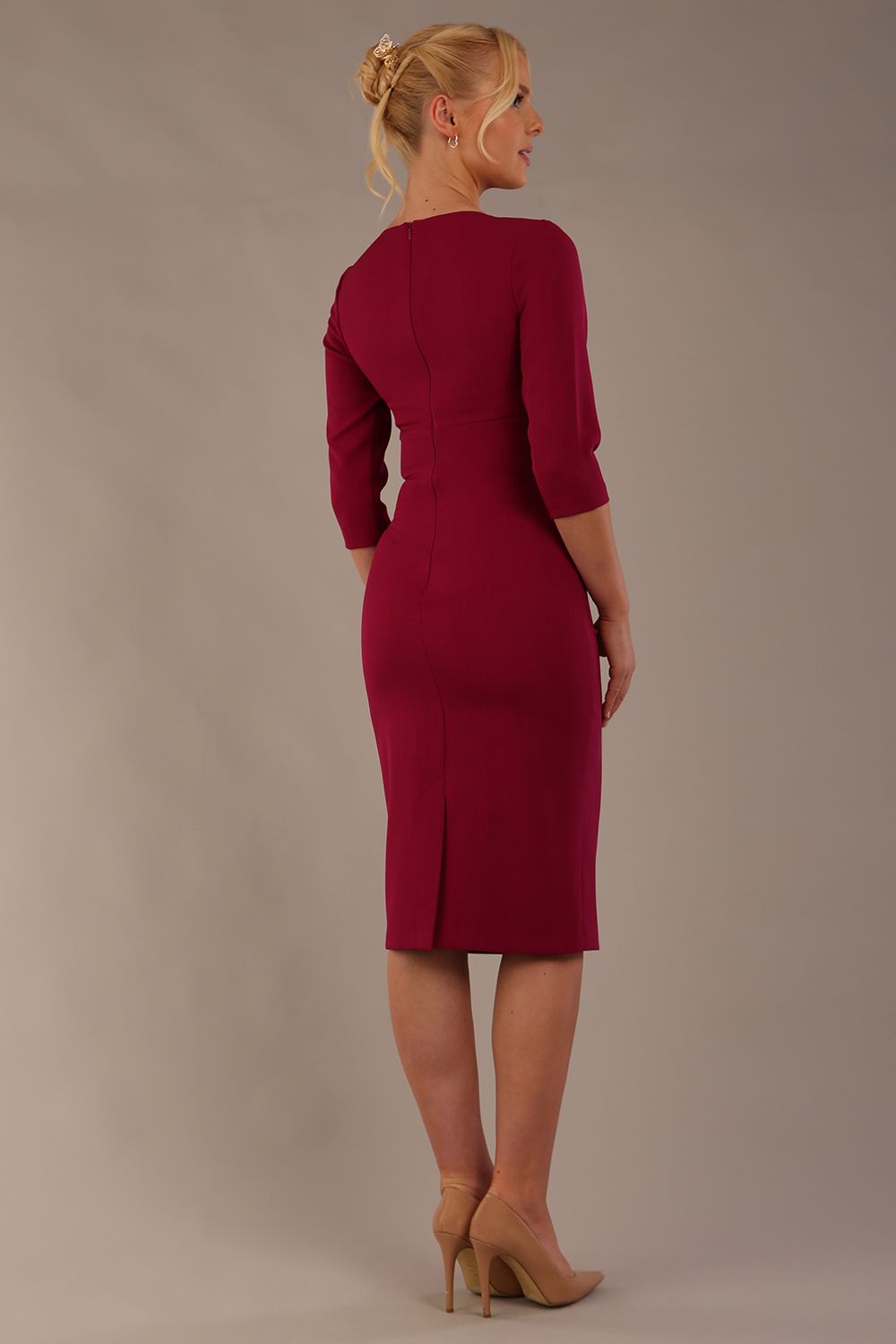 model wearing diva catwalk ubrique pencil dress with a keyhole detail and sleeves in berry pink colour front (Berry Pink)