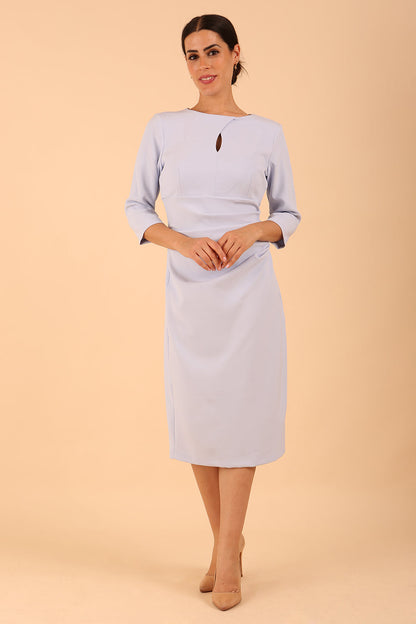 brunette model wearing diva catwalk ubrique pencil dress with a keyhole detail and sleeves in celestial blue colour front (Celestial Blue)