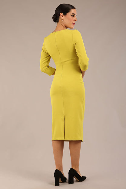 model is wearing the Diva Catwalk Ubrique pencil dress with Long sleeves and keyhole detail in Citrus Green fabric colour front (Citrus Green)