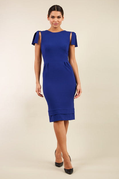 Model wearing the Diva Branwell Pencil dress with tie on shoulders in oxford blue front image