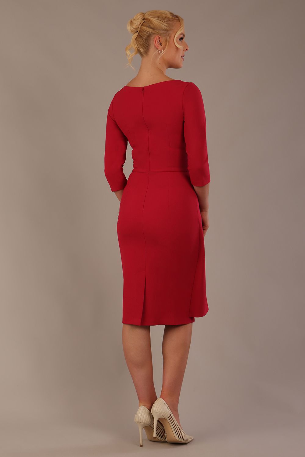 model is wearing diva catwalk jacky dress with rounded neckline 3/4 sleeve and bow detail on the waist in Dazzle pink front view (Dazzle Pink)