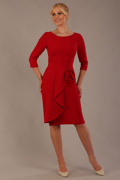 model is wearing diva catwalk jacky dress with rounded neckline 3/4 sleeve and bow detail on the waist in scarlet red front view (Scarlet Red)