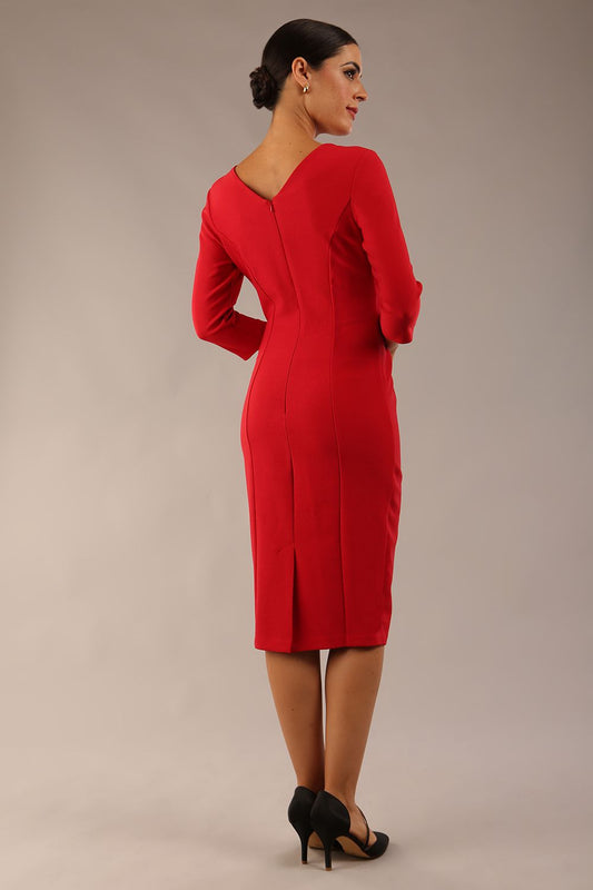 Model wearing diva catwalk Seed Andante Pencil Skirt Dress with 3/4 sleeve and bow detail at waistline in Salsa Red front
