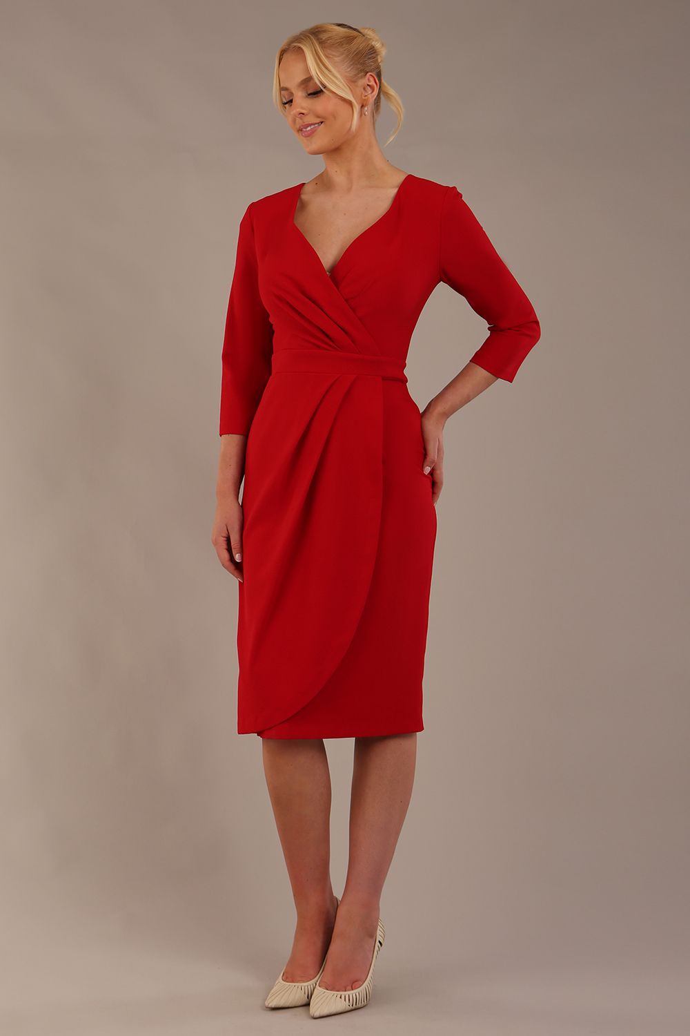 model wearing diva pencil dress tulip design with overlapping pencil skirt with 3 4 sleeves in colour scarlet red front (Scarlet Red)