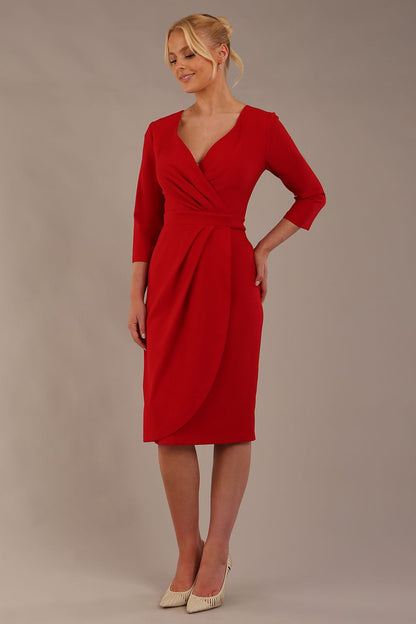model wearing diva pencil dress tulip design with overlapping pencil skirt with 3 4 sleeves in colour scarlet red front (Scarlet Red)