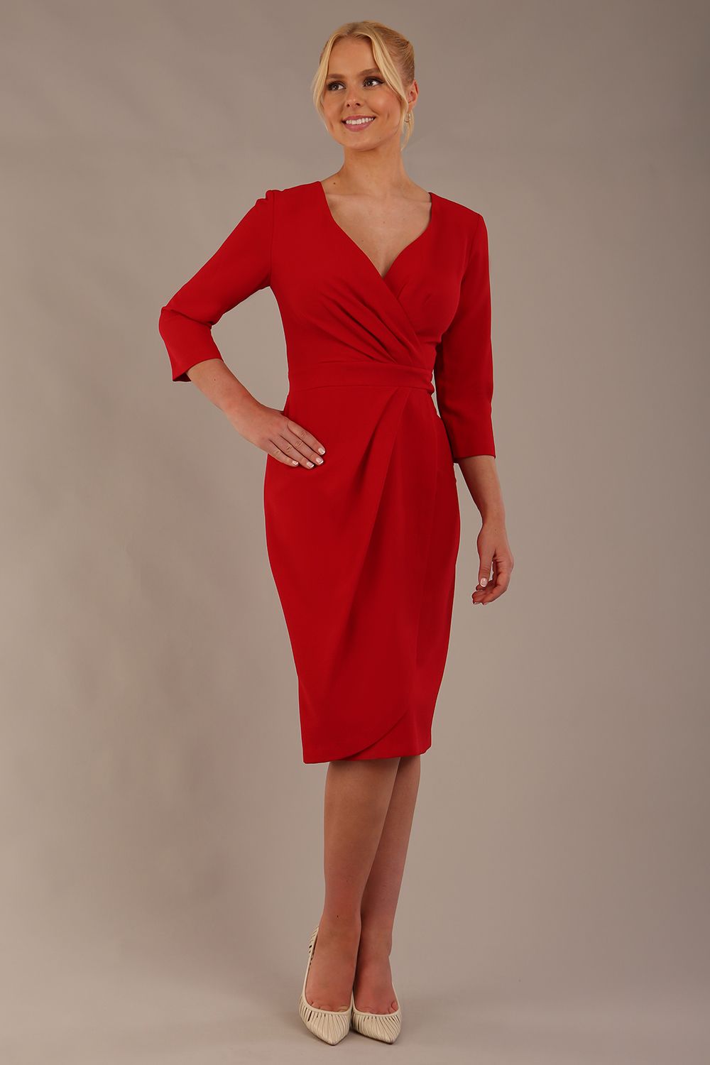 model wearing diva pencil dress tulip design with overlapping pencil skirt with 3 4 sleeves in colour scarlet red front (Scarlet Red)