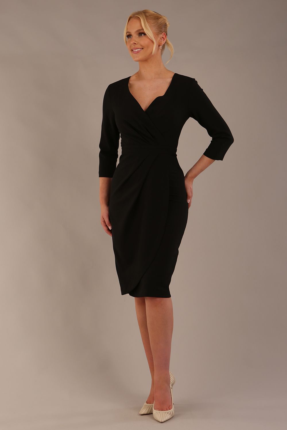 model wearing diva pencil dress tulip design with overlapping pencil skirt with 3 4 sleeves in colour black front (Black)
