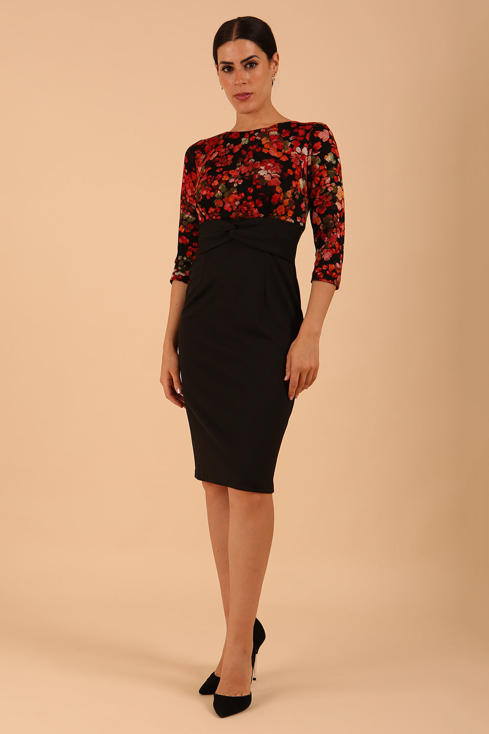 Model wearing the Diva Chiltern Print dress with round neckline in autumnal print back image