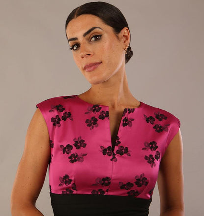 brunette model wearing diva catwalk  dresses from england nadia colour block in black and pink colours sleeveless dress front