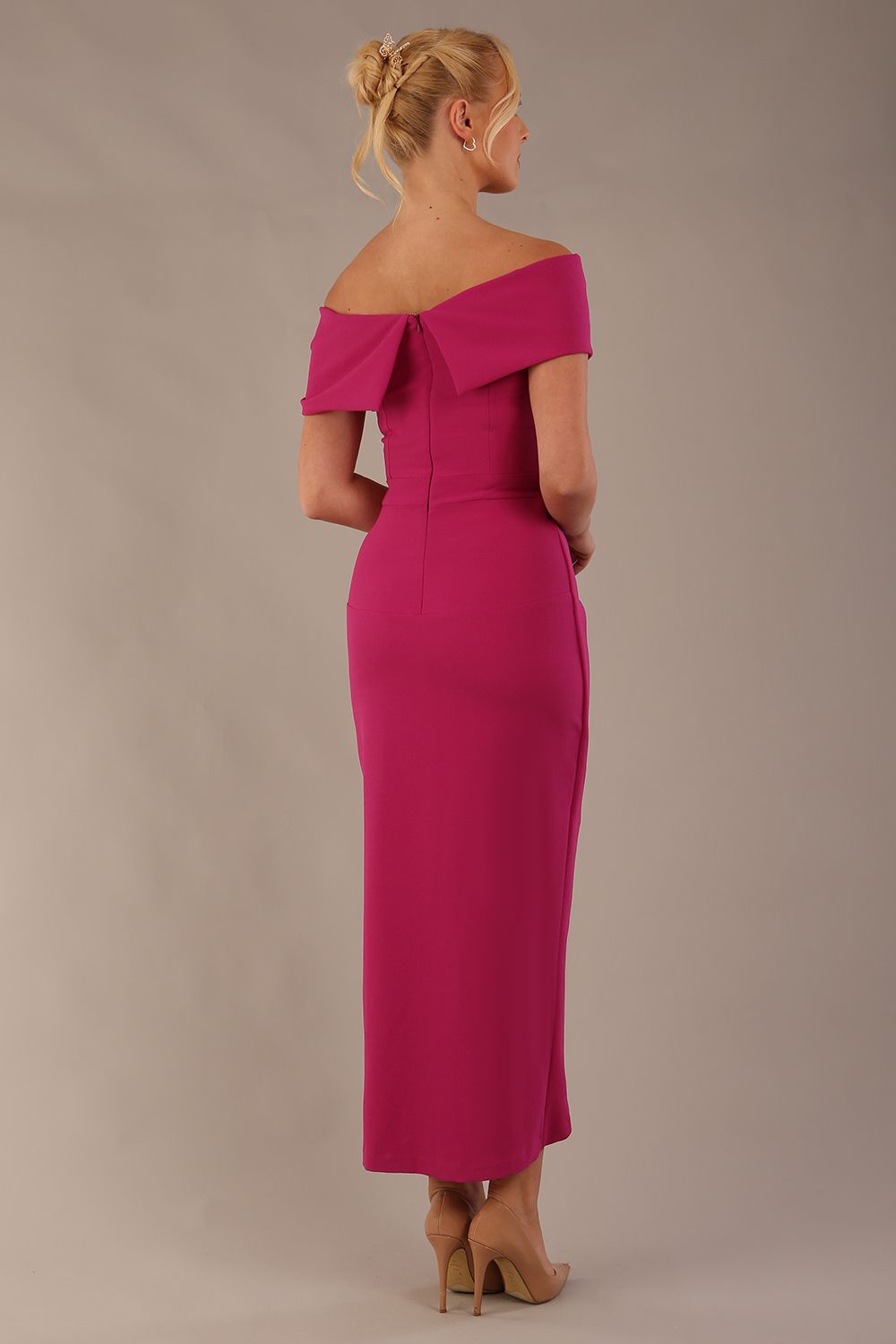 model wearing diva catwalk vegas calf length magenta midaxi dress with wide bardot neckline and open shoulders with a large opening at the front of the skirt with pleating coming down long skirt front (Magenta)