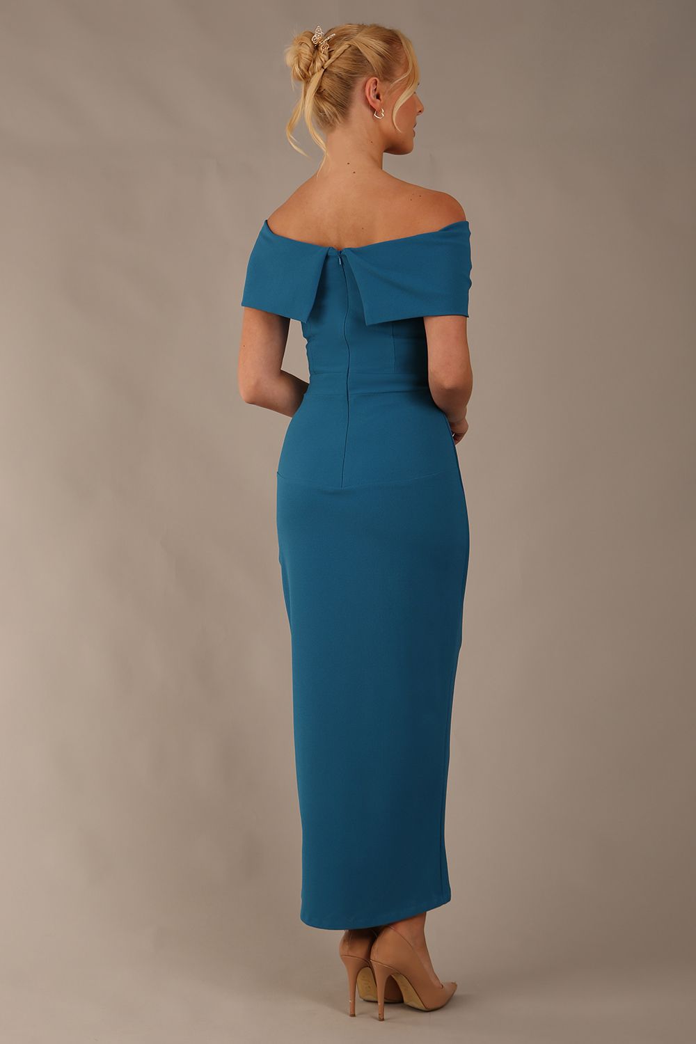 model wearing diva catwalk vegas calf length Teal midaxi dress with wide bardot neckline and open shoulders with a large opening at the front of the skirt with pleating coming down long skirt front (Tropical Teal)