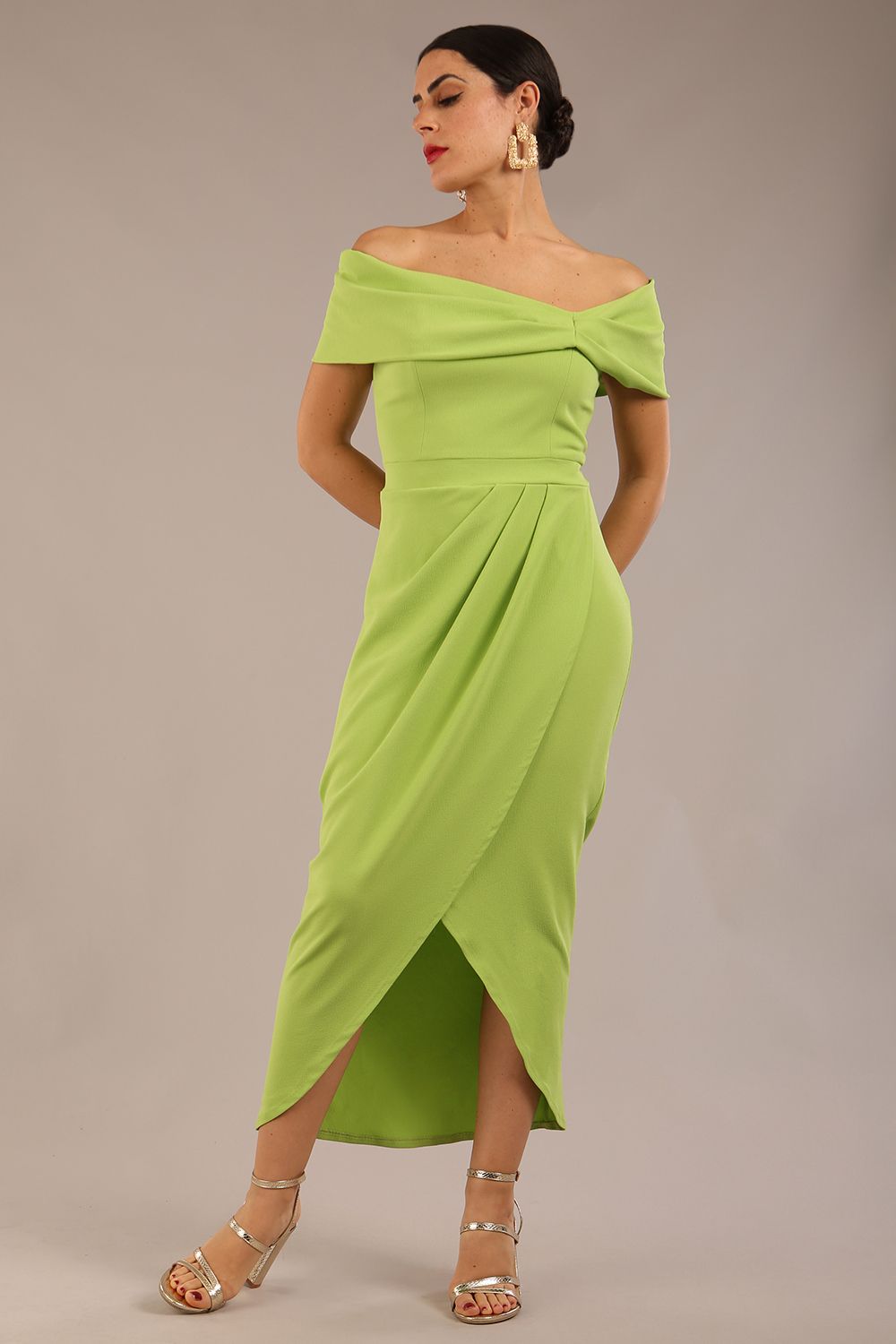 brunette model wearing diva catwalk vegas calf length lime green midaxi dress with wide bardot neckline and open shoulders with a large opening at the front of the skirt with pleating coming down long skirt front (Lime Green)