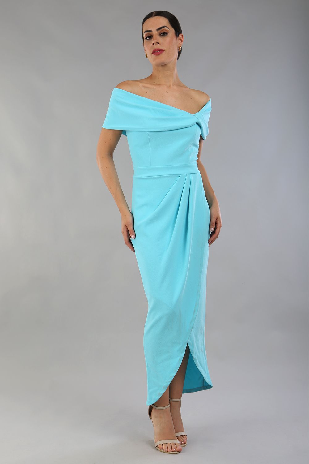brunette model wearing diva catwalk vegas calf length turquoise midaxi dress with wide bardot neckline and open shoulders with a large opening at the front of the skirt with pleating coming down long skirt front (Turquoise)