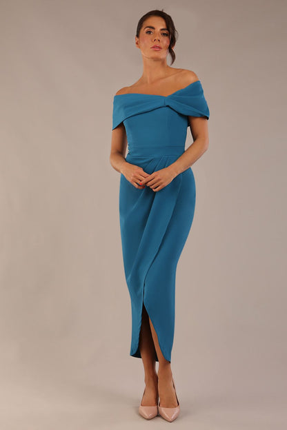 model wearing diva catwalk vegas calf length Teal midaxi dress with wide bardot neckline and open shoulders with a large opening at the front of the skirt with pleating coming down long skirt front (Tropical Teal)