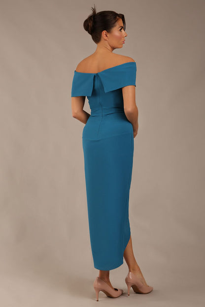 model wearing diva catwalk vegas calf length Teal midaxi dress with wide bardot neckline and open shoulders with a large opening at the front of the skirt with pleating coming down long skirt front (Tropical Teal)