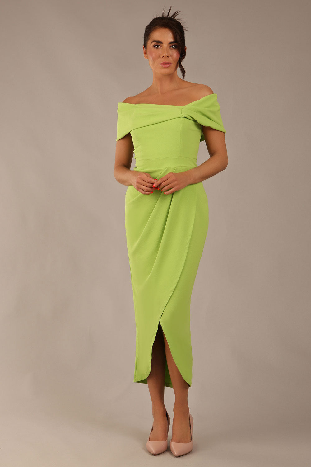 brunette model wearing diva catwalk vegas calf length lime green midaxi dress with wide bardot neckline and open shoulders with a large opening at the front of the skirt with pleating coming down long skirt front (Lime Green)